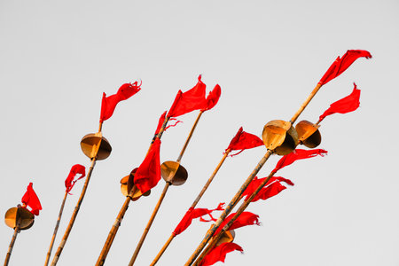Close-up of the red flags of a fishing boat against a gray background.の写真素材