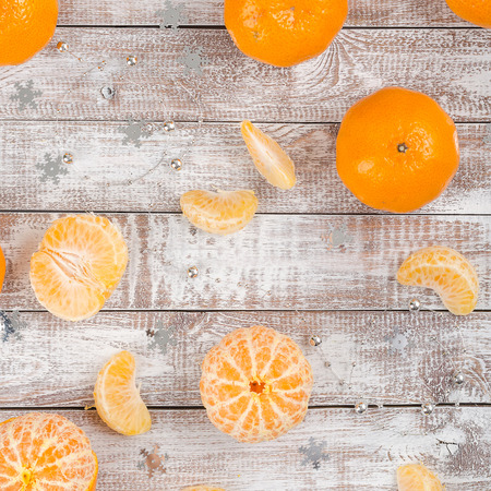 Peele dripe tangerines on wooden light backgroundの写真素材