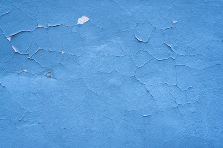 Blue shabby textural background. Cracked paint wall.の写真素材