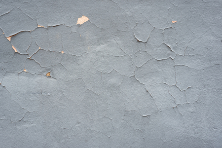 Gray shabby textural background. Cracked paint wall.の写真素材