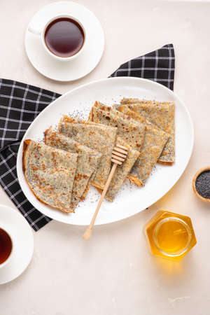 Thin crepes with poppy seeds.の写真素材