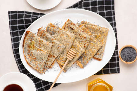 Thin crepes with poppy seeds.の写真素材