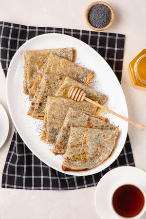 Thin crepes with poppy seeds.の写真素材