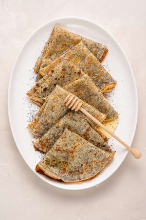 Thin crepes with poppy seeds.の写真素材