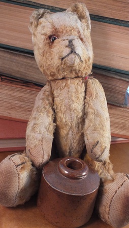 antique childhood memories - teddy bear, books and inkwellの写真素材