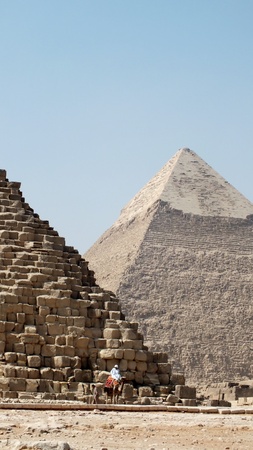 Great pyramids at Giza, Egypt. Man on camel in foregroundのeditorial素材