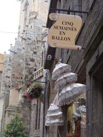 Shop signs in French street, Dinan, Brittany のeditorial素材