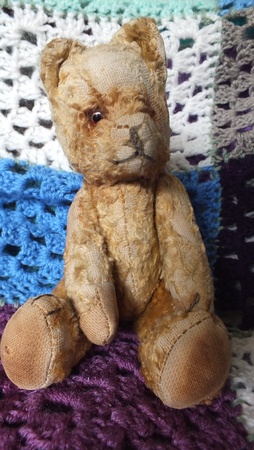 Vintage teddy bear on crochet blanketの写真素材