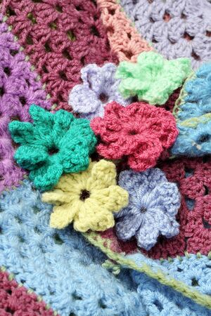 Crocheted flowers on a square patch work  afghan crochet blanketの写真素材