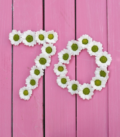 Number 70 made out of daisy heads, a floral seventy, 70th birthday card image , bright pink wooden...