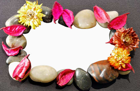 Frame for photo or text made of pressed flowers and stonesの写真素材