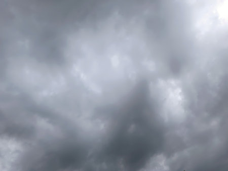Gray thick dark thunderclouds in the skyの写真素材