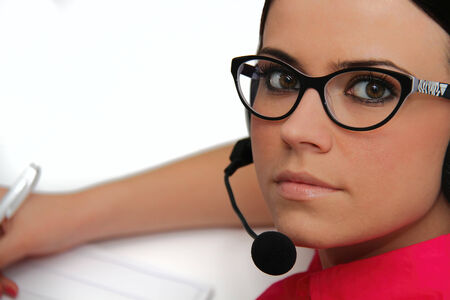 Female customer service representative with headsetの写真素材