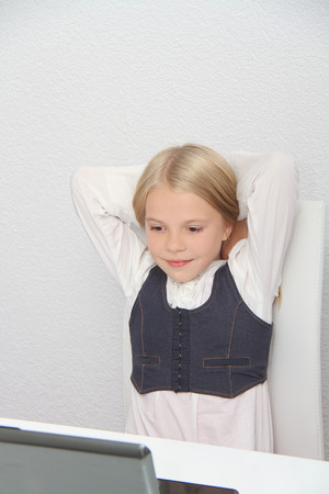 Young Girl Using Laptop At Homeの写真素材