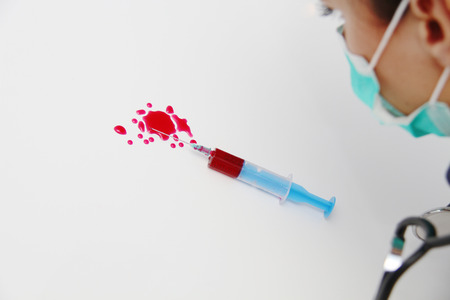 Syringe of Red Blood Test for research HIV AIDS Concept Ideaの写真素材