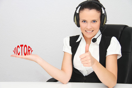 Female customer support operator with headsetの写真素材