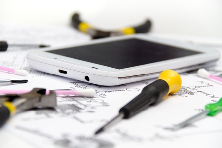 Photo of the Technical operator and repair smartphoneの写真素材