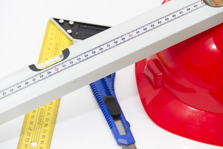Photo of the Helmet and tools for construction drawings and buildingsの写真素材