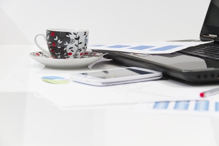 Photo of the Businessman  with coffee and laptop analyzing of the  monitoring profit dynamics in the...