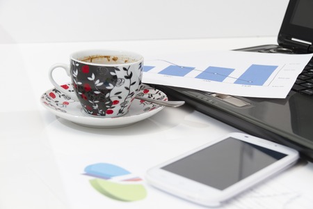 Photo of the Businessman  with coffee and laptop analyzing of the  monitoring profit dynamics in the...