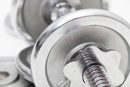 Photo of the Fitness concept with Grey dumbbells and loose weightsの写真素材