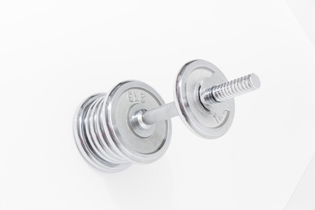 Photo of the Fitness concept with Grey dumbbells and loose weightsの写真素材