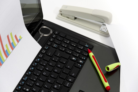 Photo of the Analyzing business investment charts with calculator and laptopの写真素材