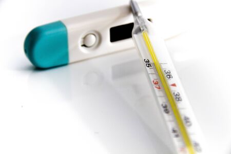 Photo of the Thermometer for body temperature on the white background, for people health