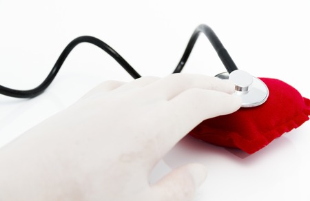 Stethoscope listening to a healthy red heart
