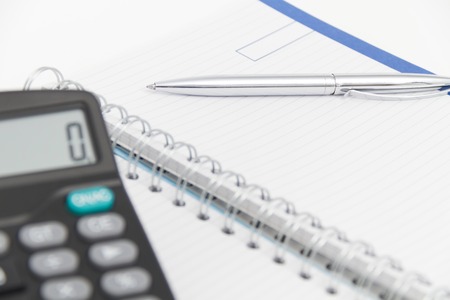 Photo of the Business concept with calculator, pen and notebookの写真素材