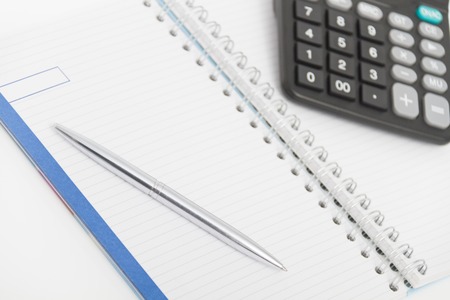 Photo of the Business concept with calculator, pen and notebookの写真素材