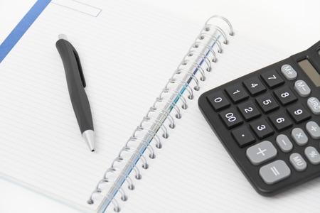 Photo of the Business concept with calculator, pen and notebookの写真素材