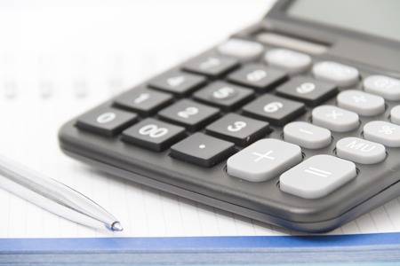 Photo of the Business concept with calculator, pen and notebook