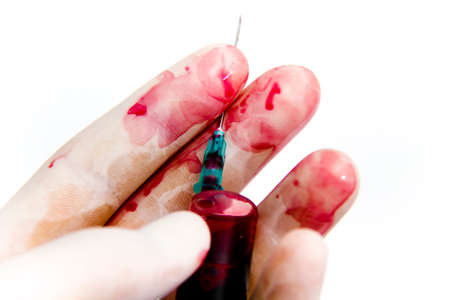 Photo of the Syringe in laboratory environment, blood and medical accessoriesの写真素材