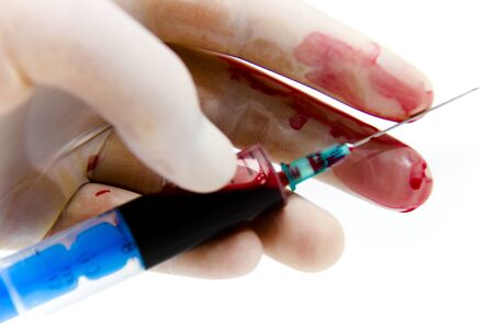 Photo of the Syringe in laboratory environment, blood and medical accessoriesの写真素材