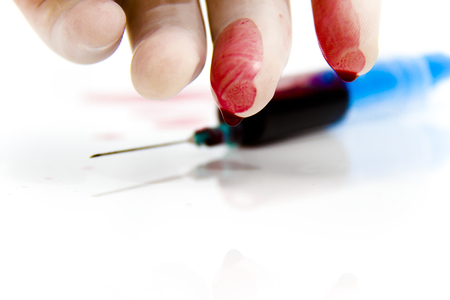 Photo of the Syringe in laboratory environment, blood and medical accessoriesの写真素材