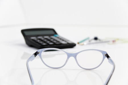 Photo of the Business Architectural project, pair of compasses, glasses, rulers and calculator - business conceptの写真素材