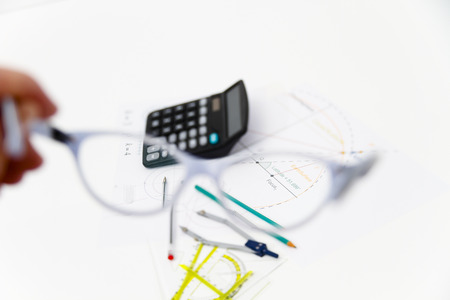 Photo of the Business Architectural project, pair of compasses, glasses, rulers and calculator - business conceptの写真素材