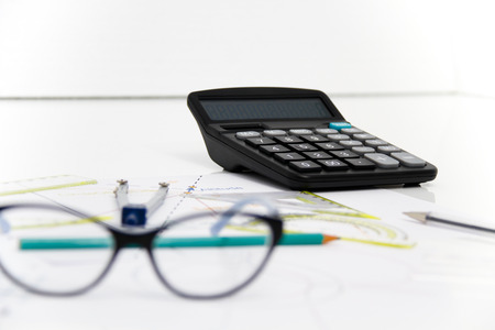 Photo of the Business Architectural project, pair of compasses, glasses, rulers and calculator - business conceptの写真素材