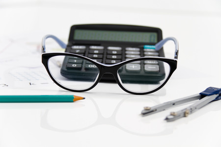 Photo of the Business Architectural project, pair of compasses, glasses, rulers and calculator - business conceptの写真素材