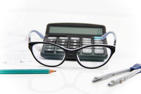 Photo of the Business Architectural project, pair of compasses, glasses, rulers and calculator - business conceptの写真素材