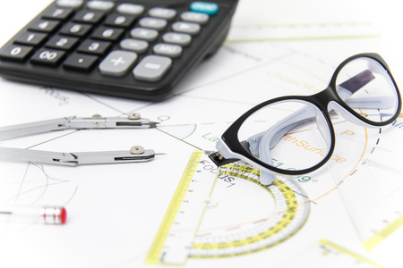Photo of the Business Architectural project, pair of compasses, glasses, rulers and calculator -...