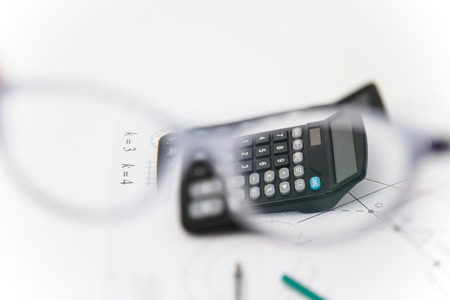 Photo of the Business Architectural project, pair of compasses, glasses, rulers and calculator - business conceptの写真素材