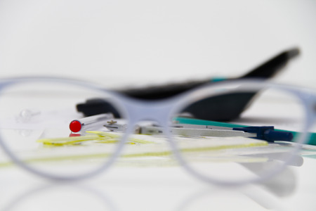Photo of the Business Architectural project, pair of compasses, glasses, rulers and calculator - business conceptの写真素材