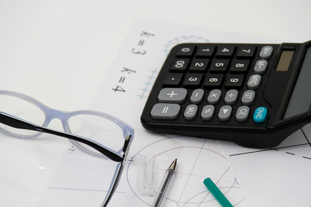 Photo of the Business Architectural project, pair of compasses, glasses, rulers and calculator - business conceptの写真素材