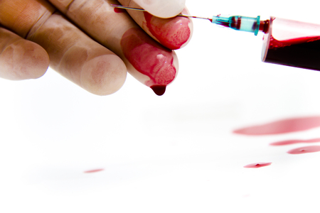 Photo of the Syringe in laboratory environment, blood and medical accessoriesの写真素材