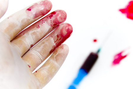 Photo of the Syringe in laboratory environment, blood and medical accessoriesの写真素材