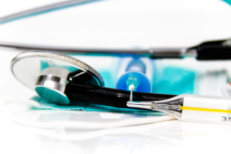 Photo of the Set for flu treatment, thermometer, nasal sprays, protective surgical mask, stethoscope, syringe...の写真素材