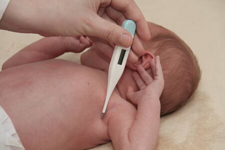 Photo of the Measuring the temperature of  baby in thermometer