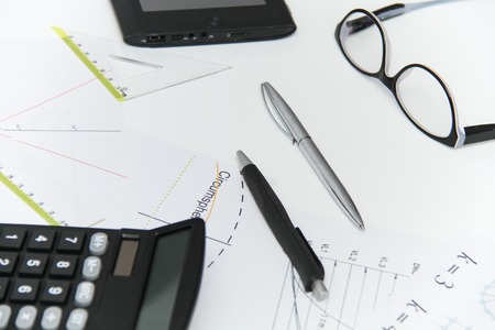 photo of the Architectural plans and projets, pencils, rulers, compass, calculator, tablet, glasses...